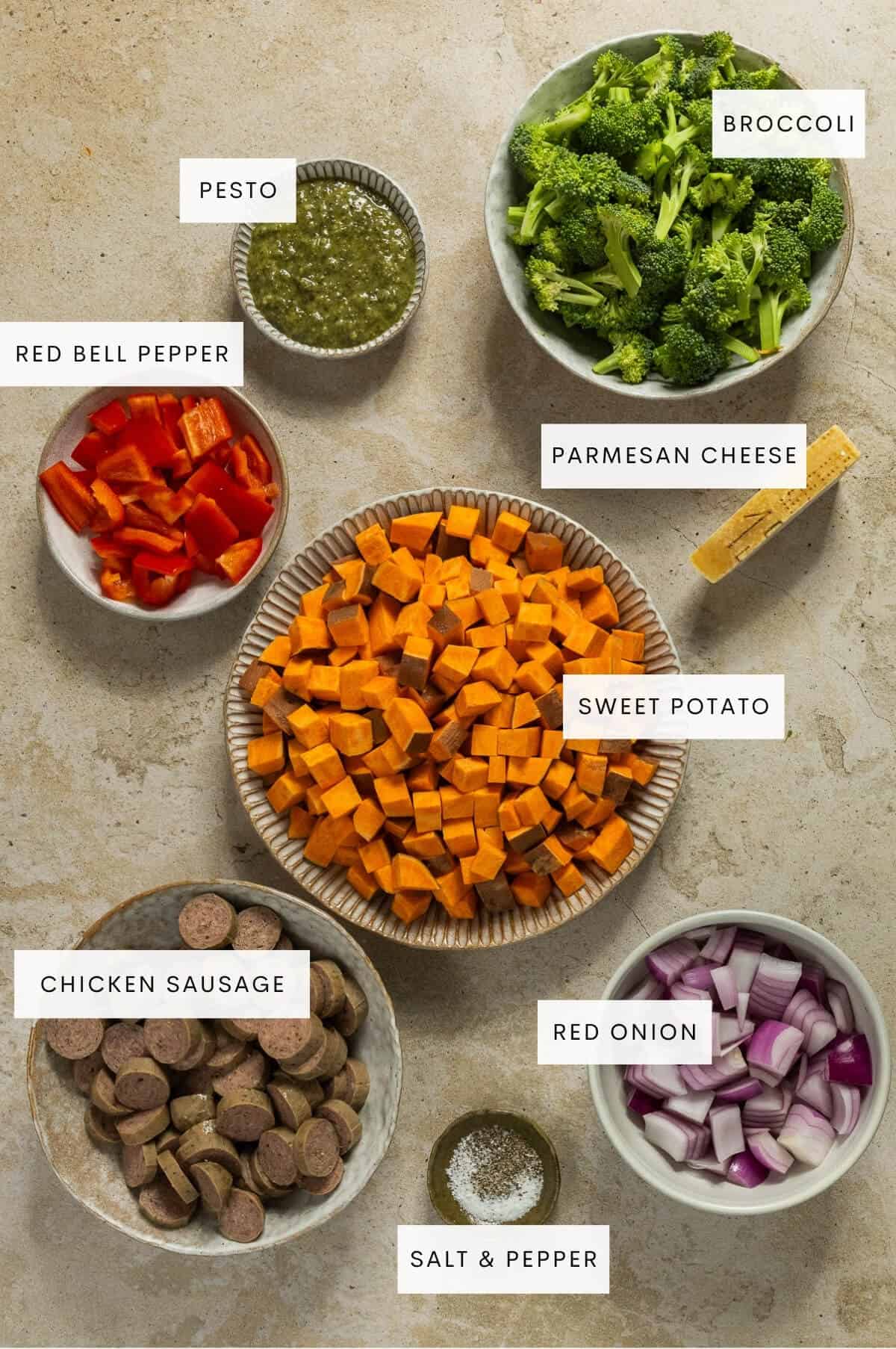 Ingredient shot for pesto chicken sausage and veggies sheet pan.