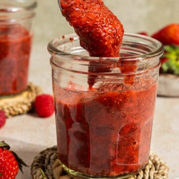 Chia jam being spooned into jar.