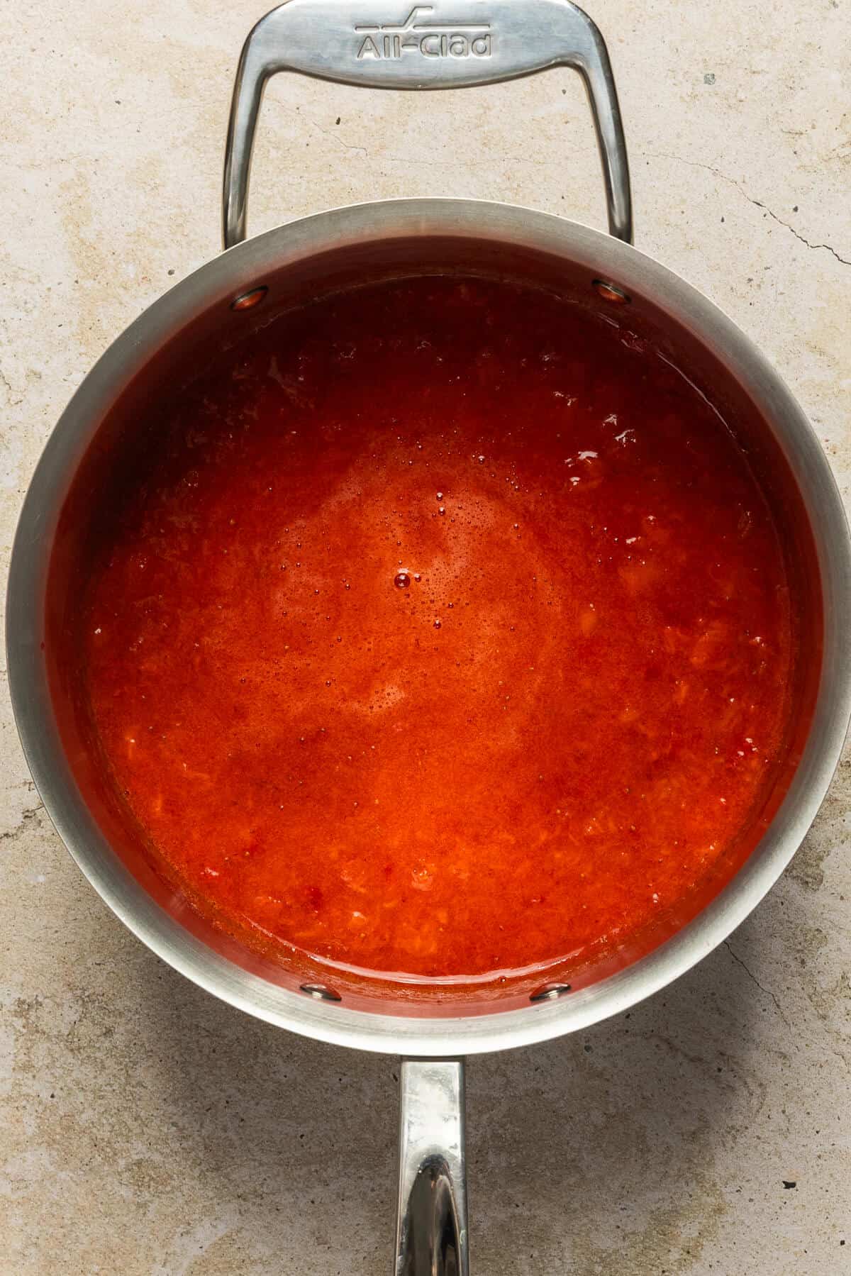 Pot of strawberries mashed.