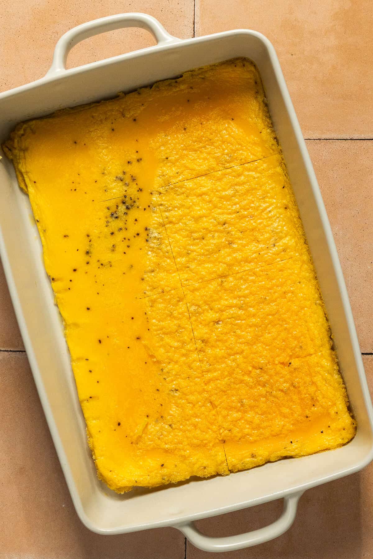 Cooked eggs in a 9x13 pan cut into 8 pieces.
