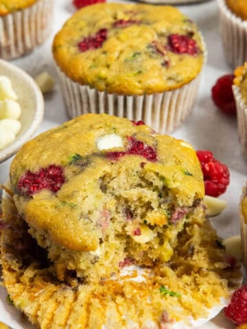 Featured image for white chocolate raspberry zucchini muffins.