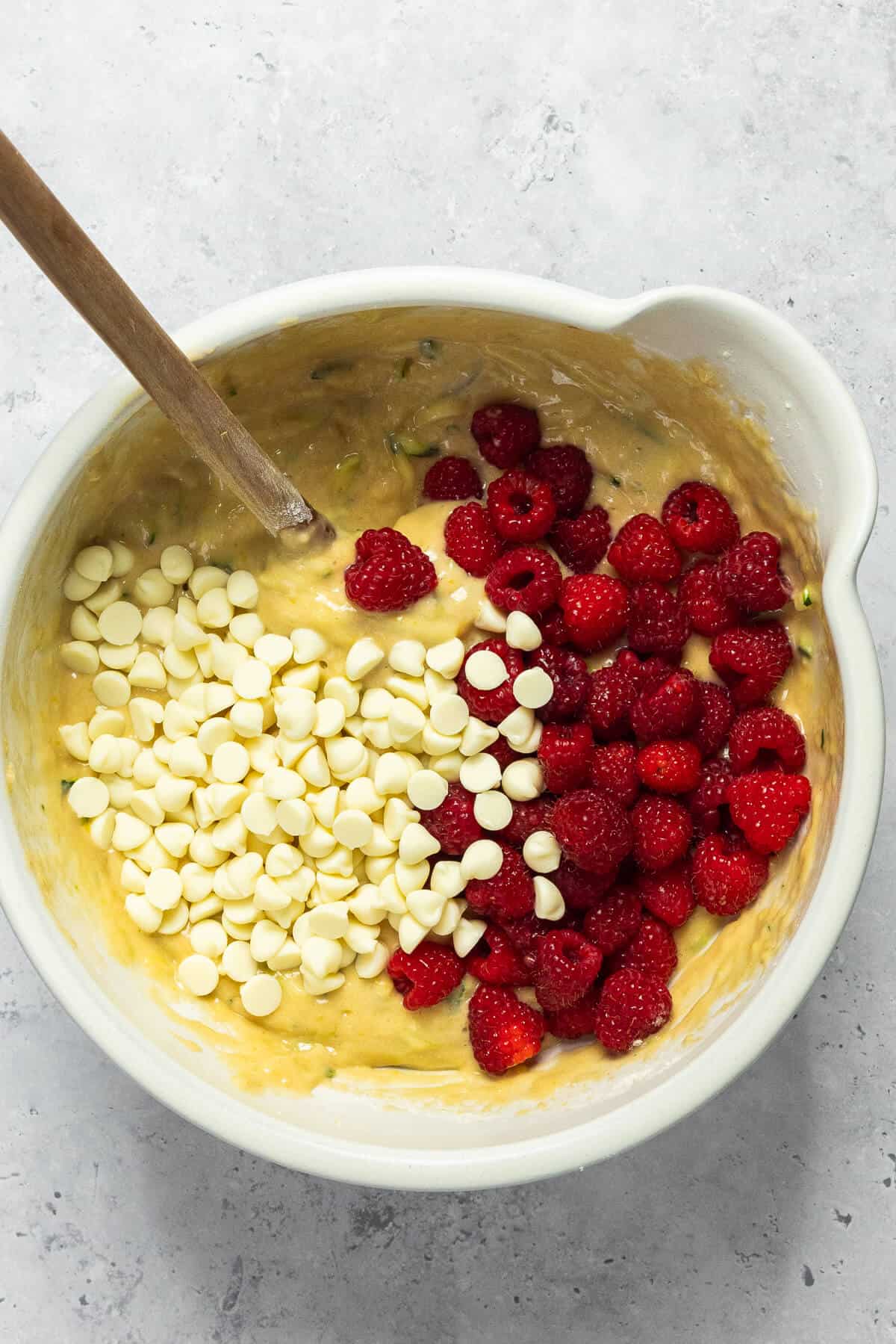 Fresh raspberries and white chocolate chips added into the muffin batter.