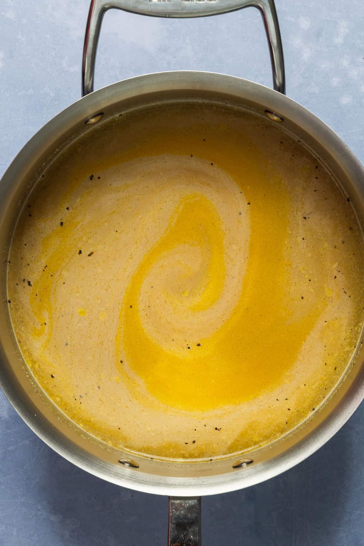 Pan of broth and seasoning.