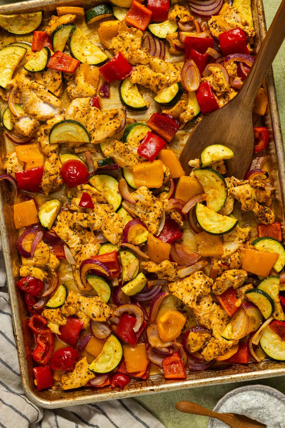 Cooked chicken and vegetables sheet pan.