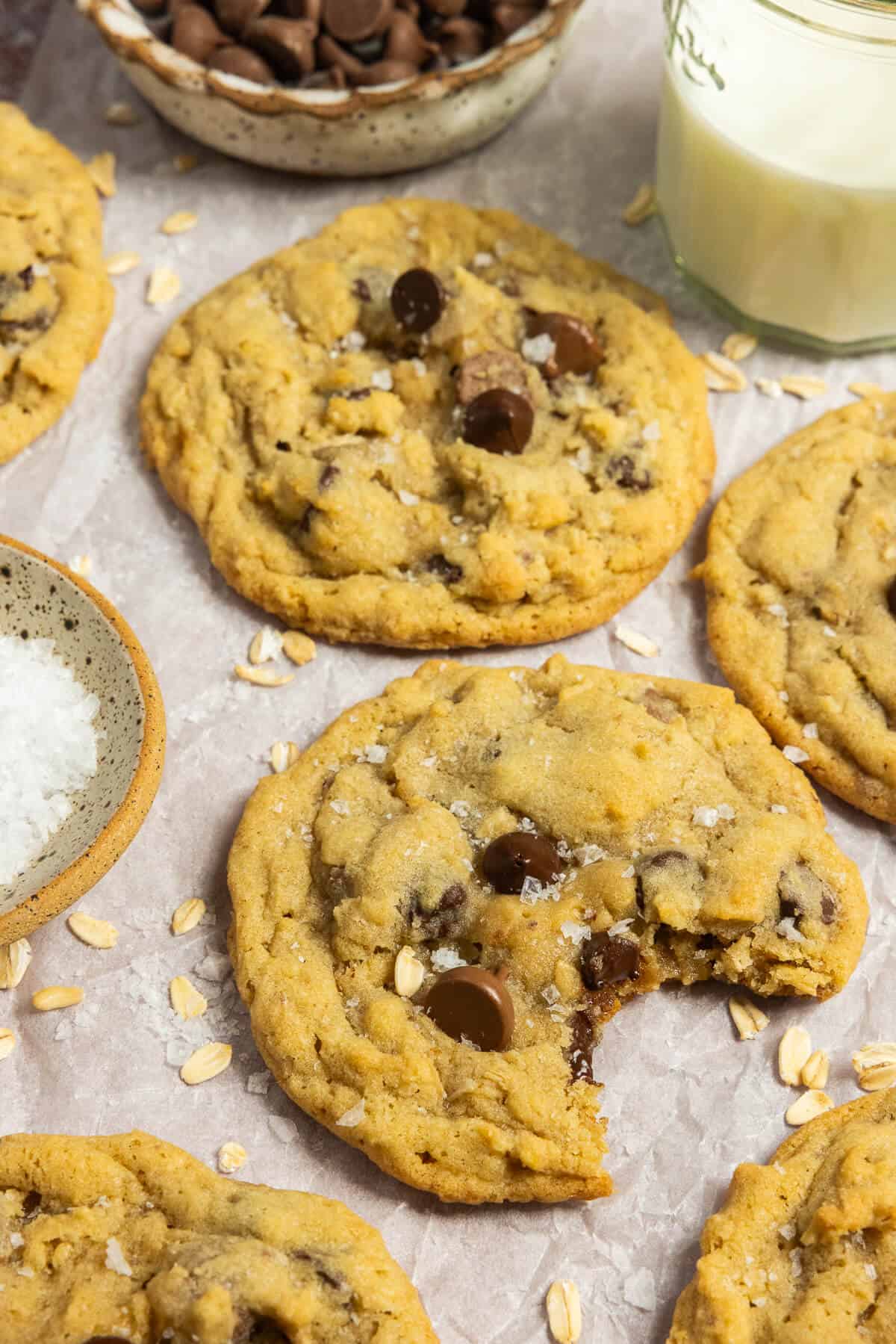 Oatmeal chocolate chip cookies on parchment paper.