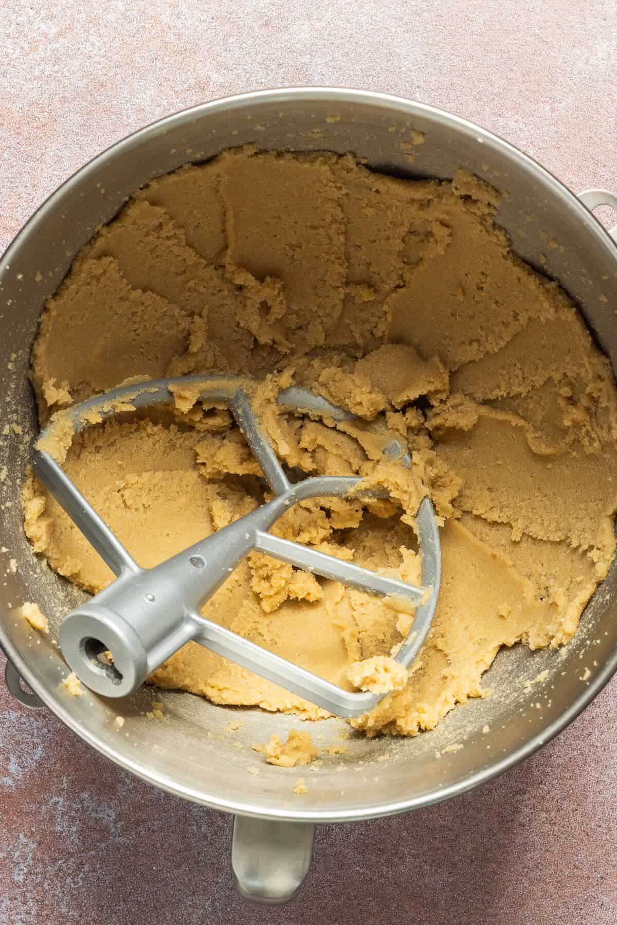 Butter and sugar creamed in a mixing bowl.