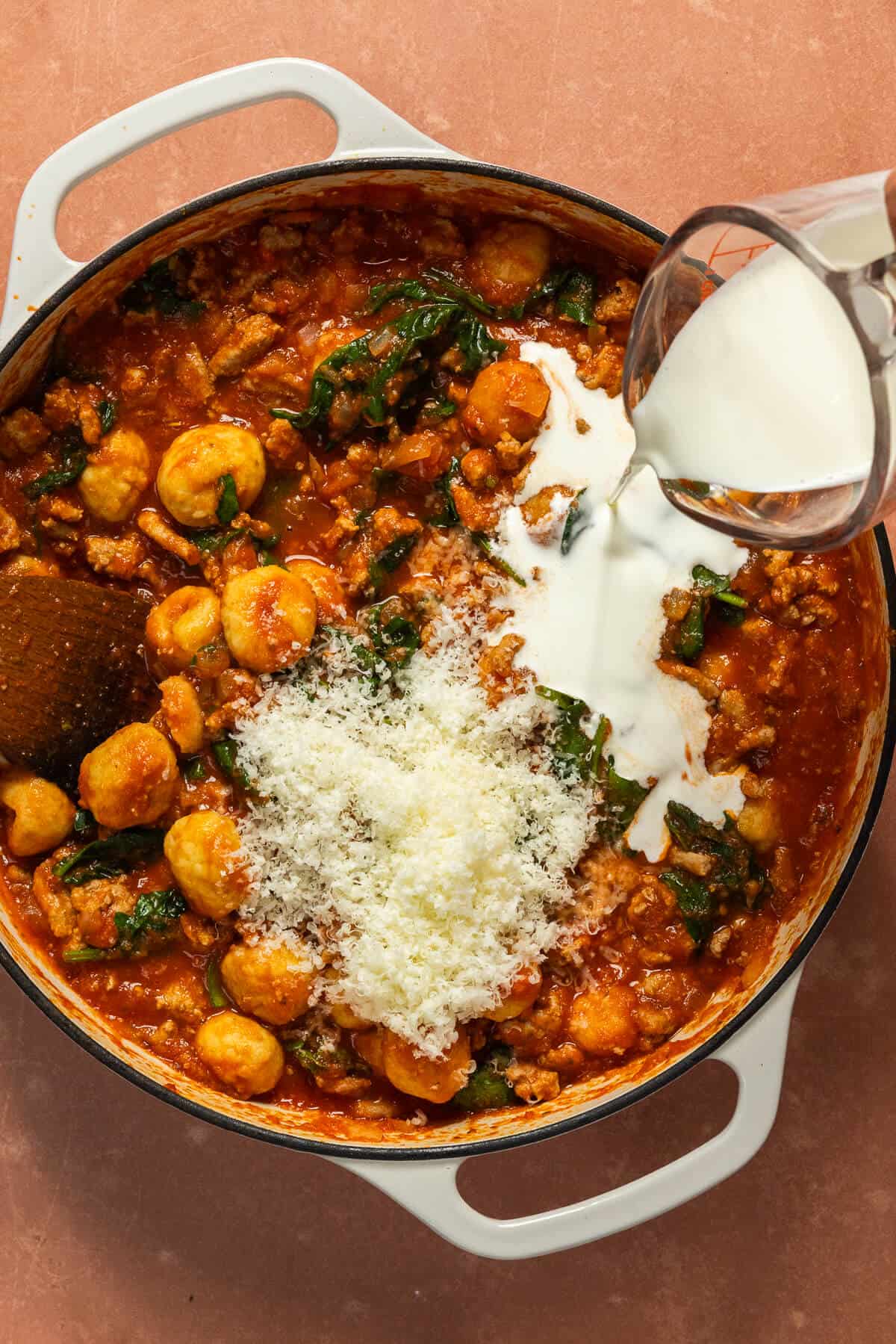 Cream and parmesan added to the one pan gnocchi.