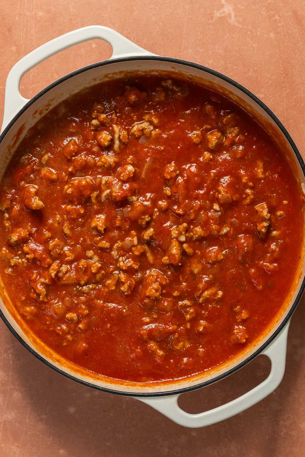Pureed tomatoes added to the skillet for the one pan gnocchi.
